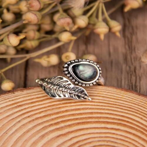 Elegant bypassring med månsten och filigranbladdesign