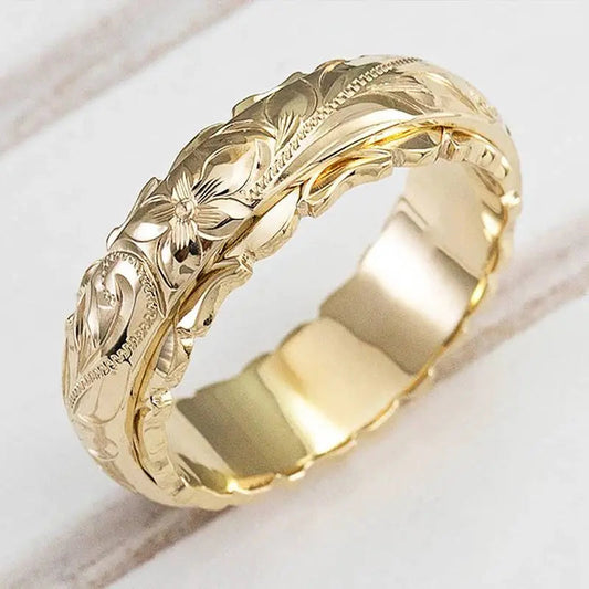 Antik-inspirerad guldblommerring – elegant vintage-smycke med filigranblommor